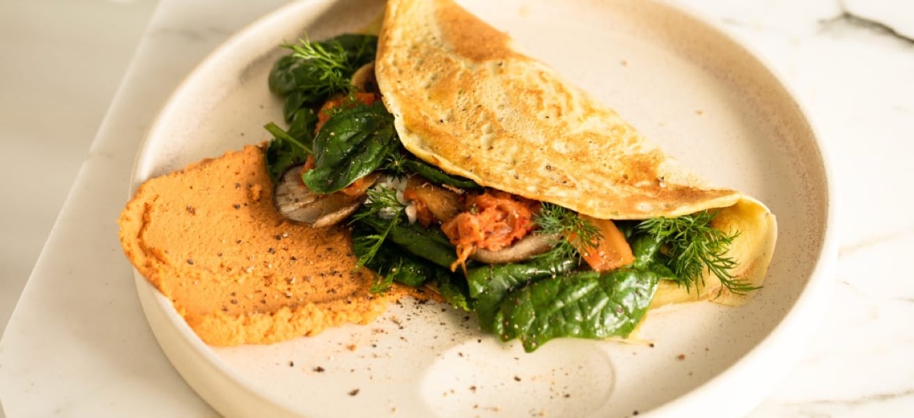 plate with an omelette and greenery